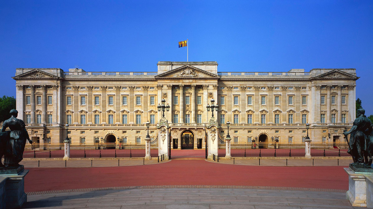 Buckingham palace on a sunny day with a clear blue sky in the background