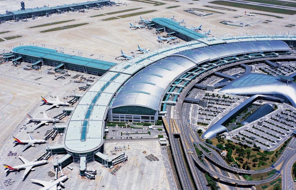 Arial view of airplanes parked at the Incheon airport in South Korea on a sunny day